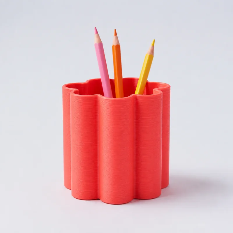 Existing catalog preview of the Coral Scalloped Pencil Cup with pencils; product photography is not verified.